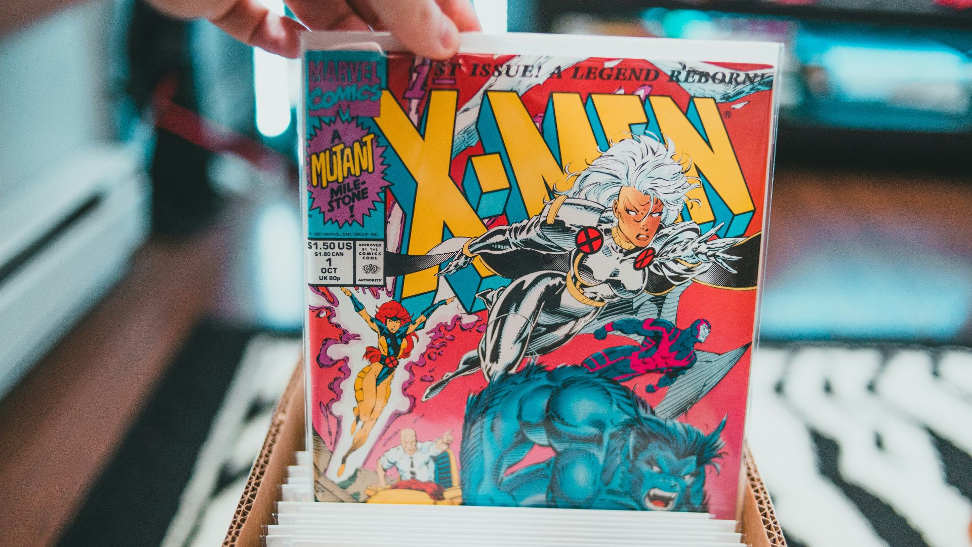 a person holding a comic book in their hand