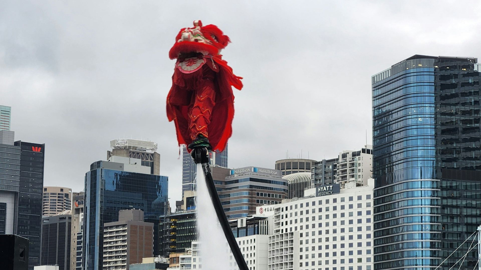 a fire hydrant spewing out water into the air