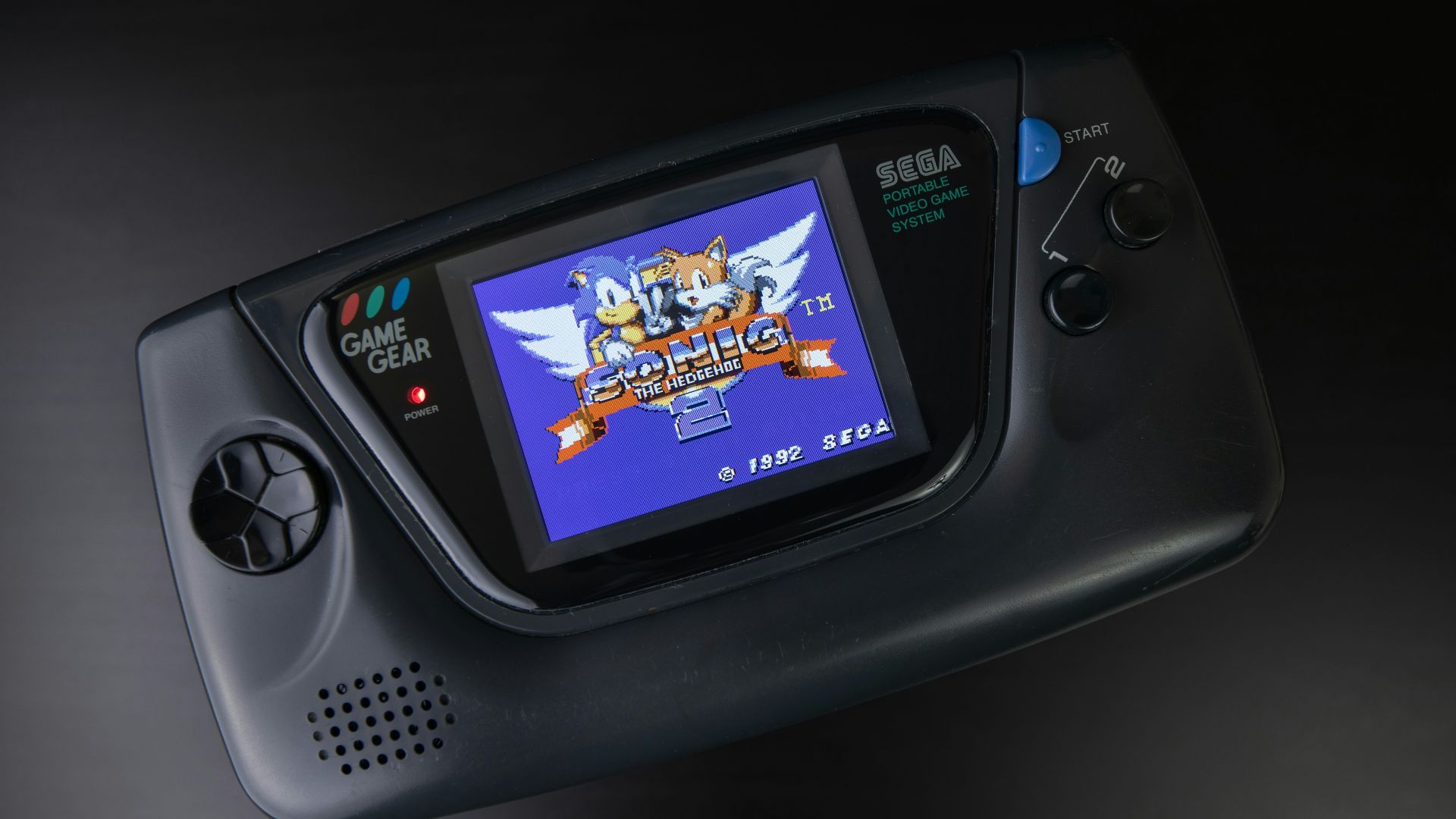 black sony digital device on black surface