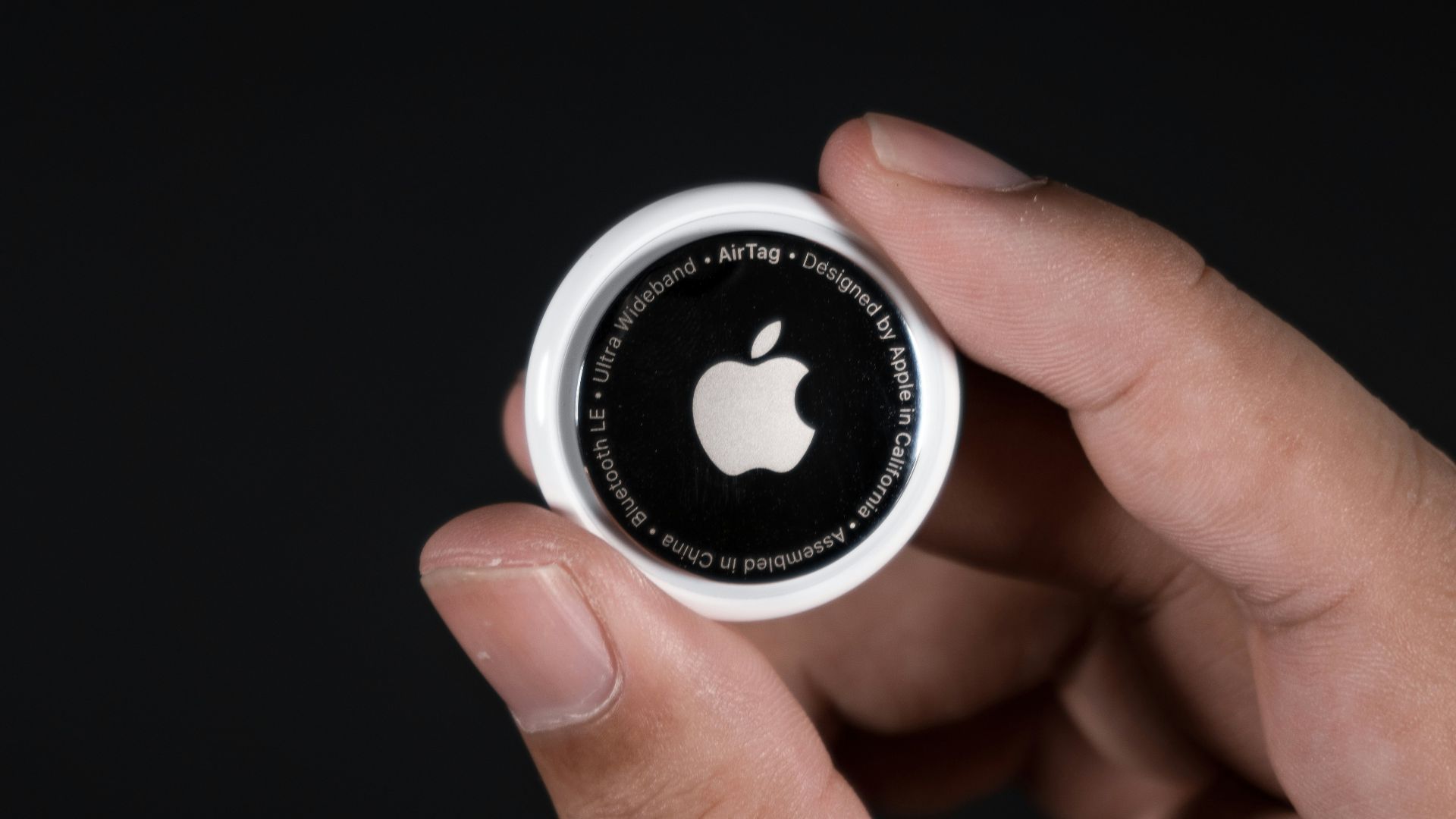 person holding black and white round ornament