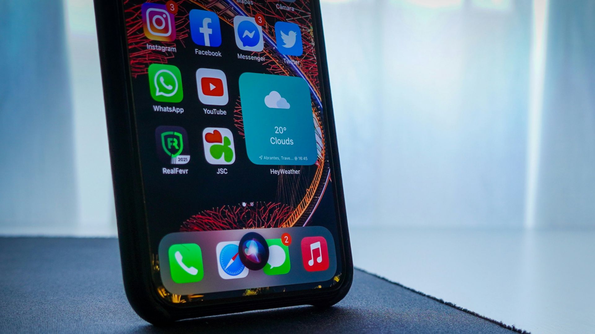 black iphone 5 on black table