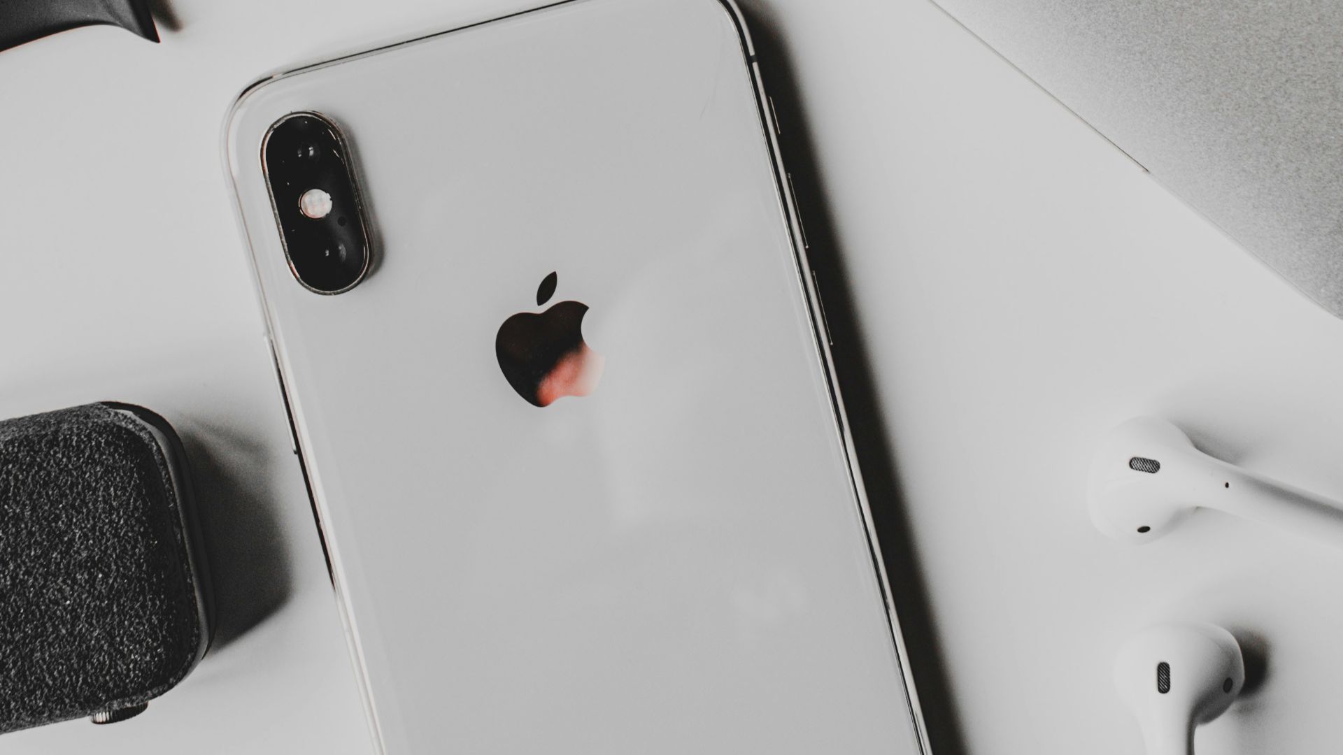 silver iphone 6 on white table