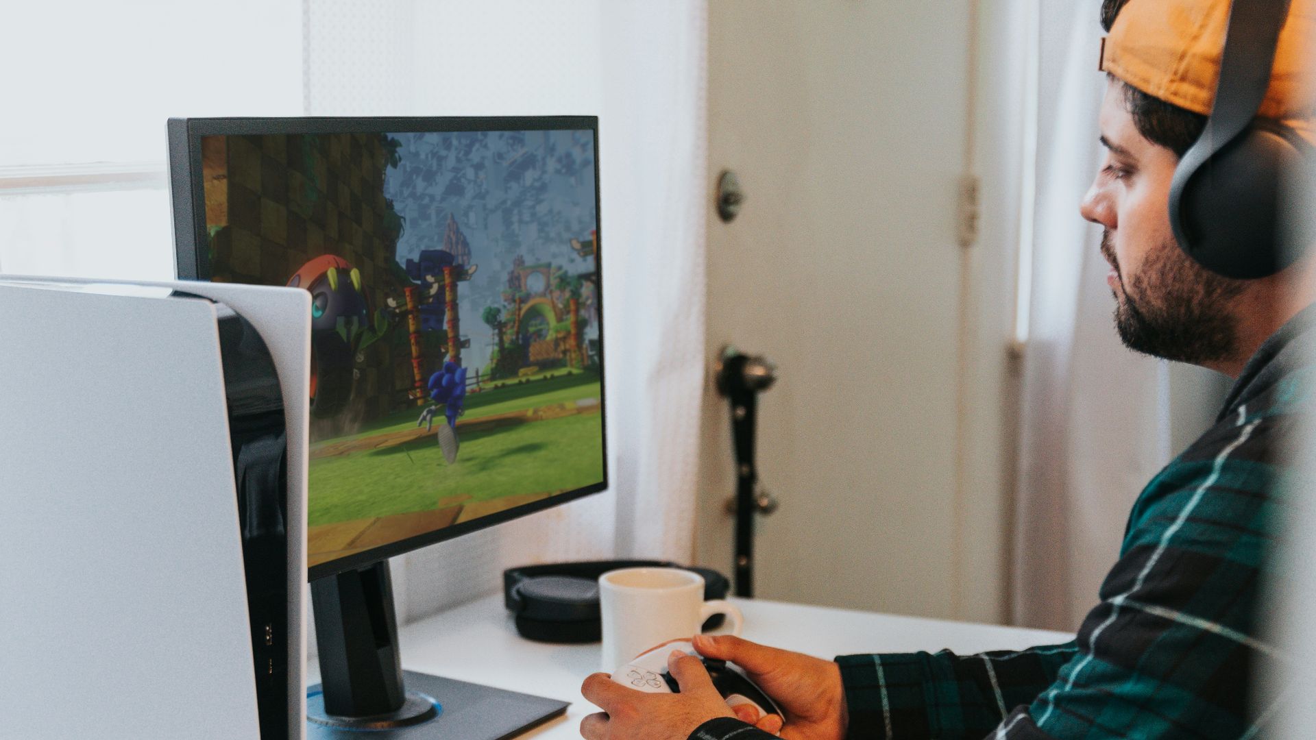 a person wearing a mask and sitting at a desk