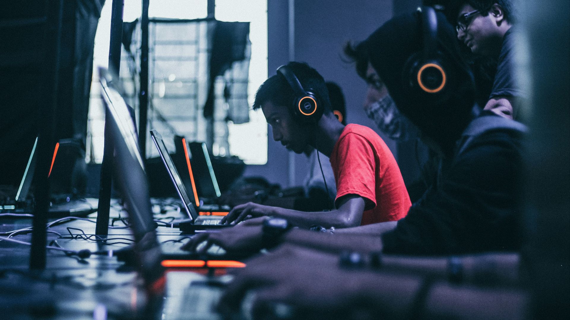 man playing on laptop