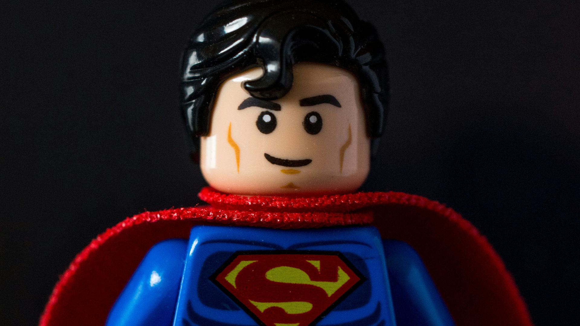 lego mini figure on red chair