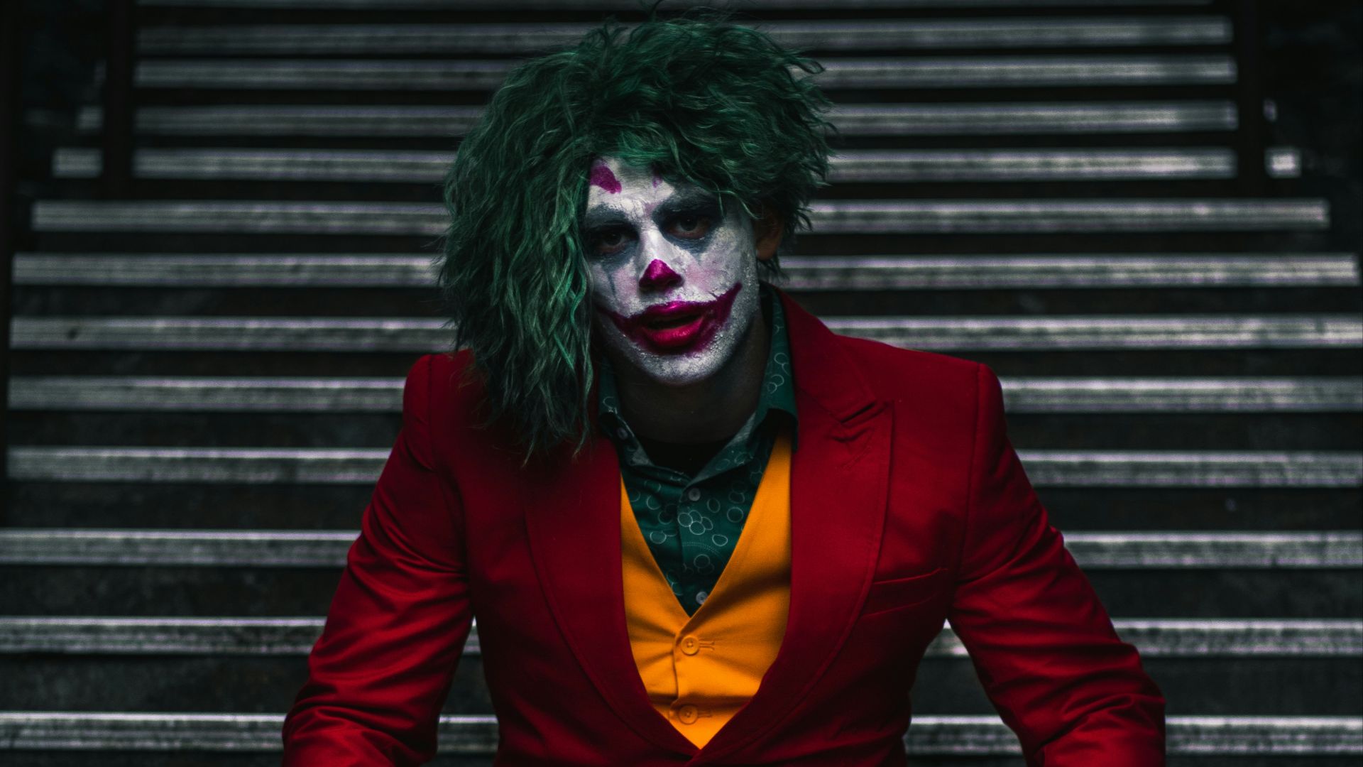 Joker sitting on stairs