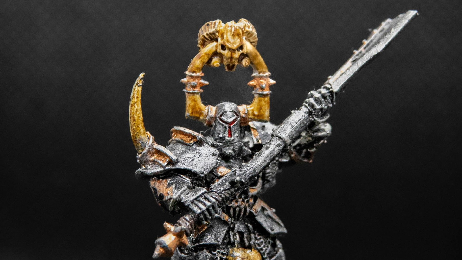 a warhammer with a sword and a skull on it