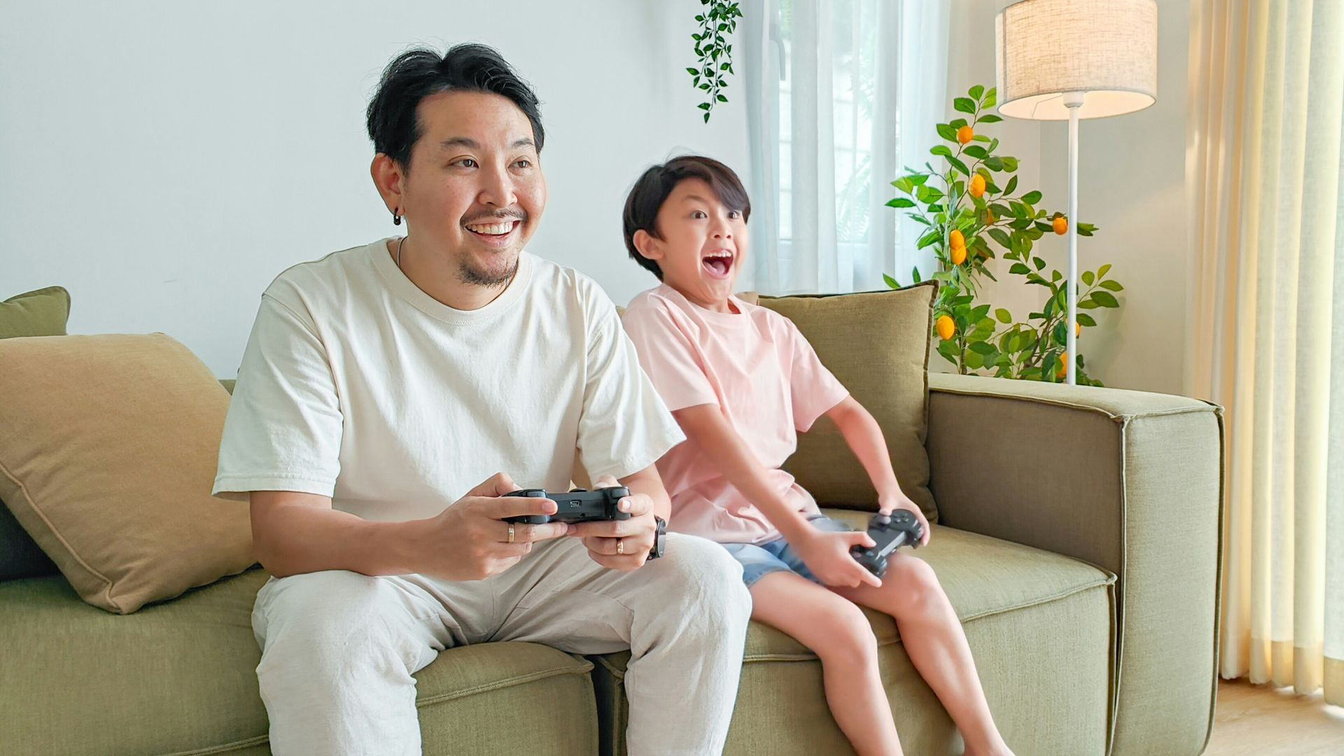 a person and a child sitting on a couch