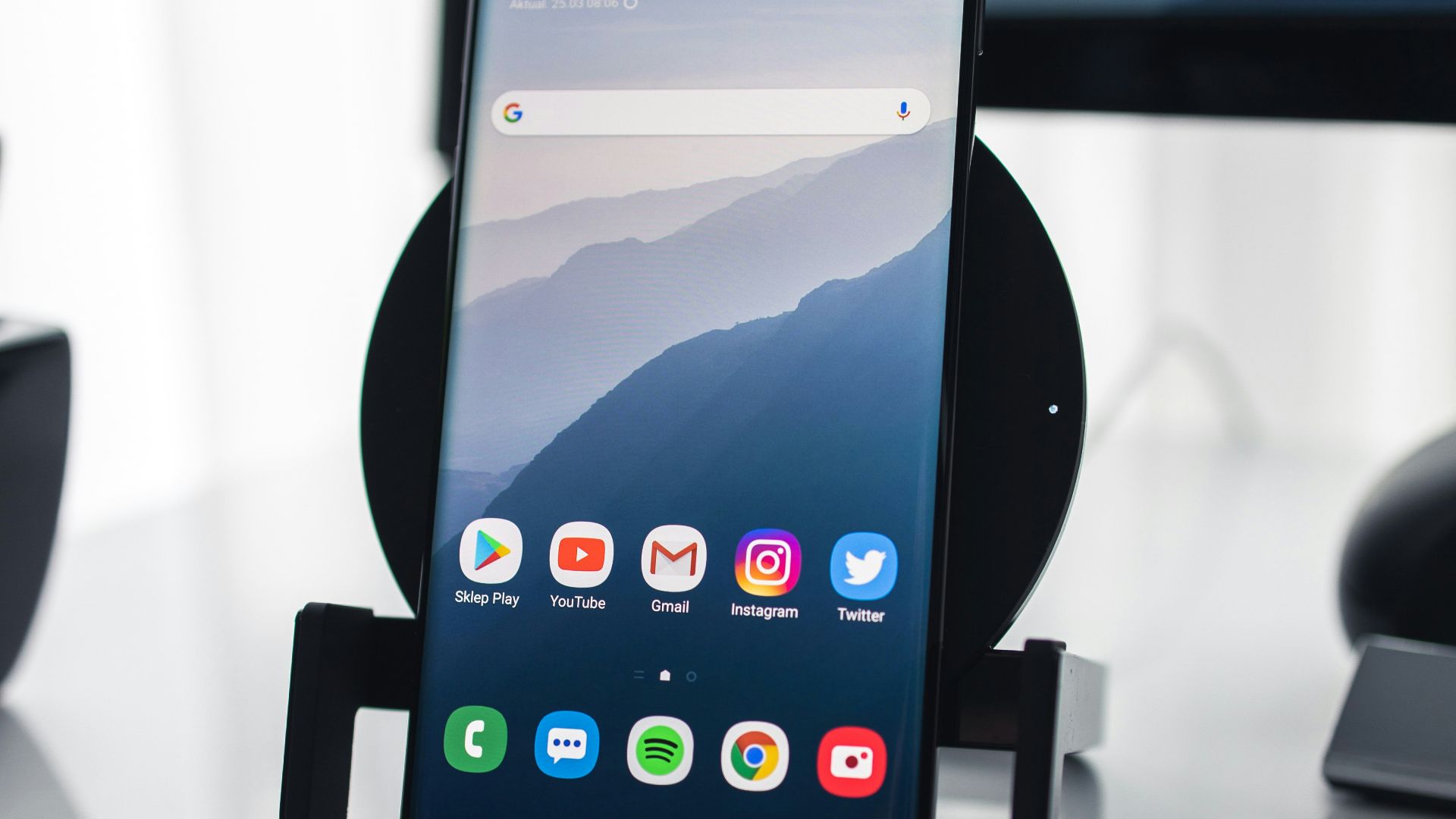 black iphone 4 on white table