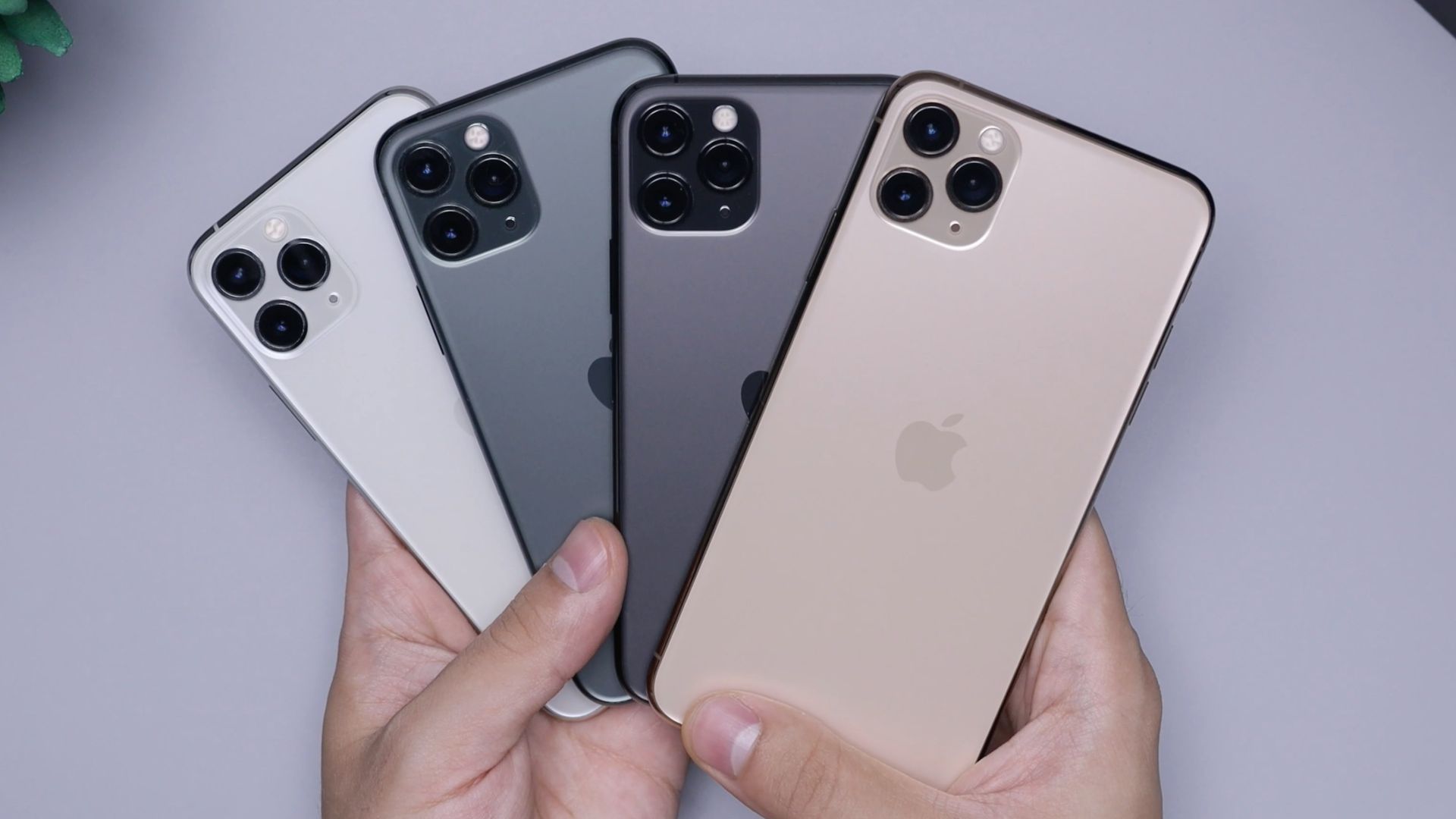 two space gray and two silver iPhone 11's