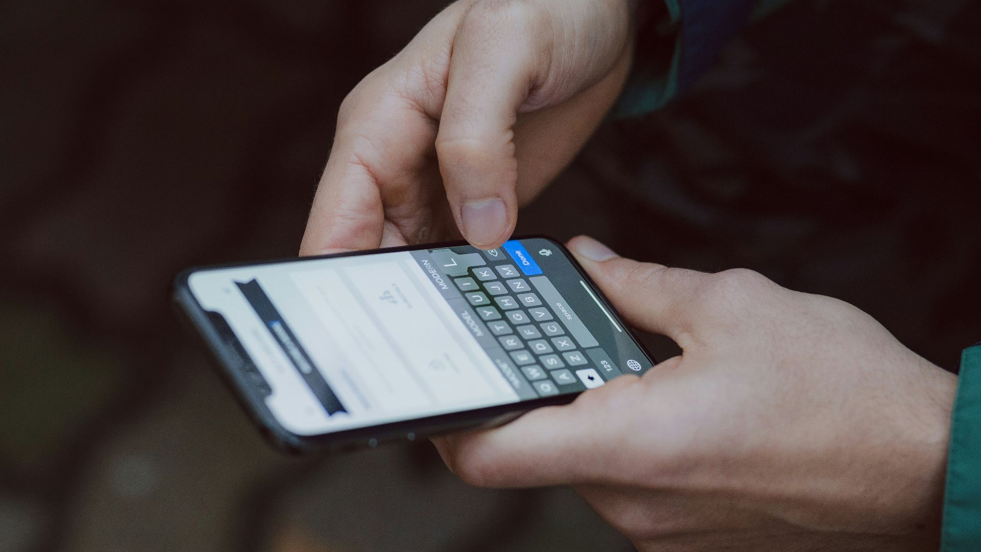 selective focus photography of person using smartphone