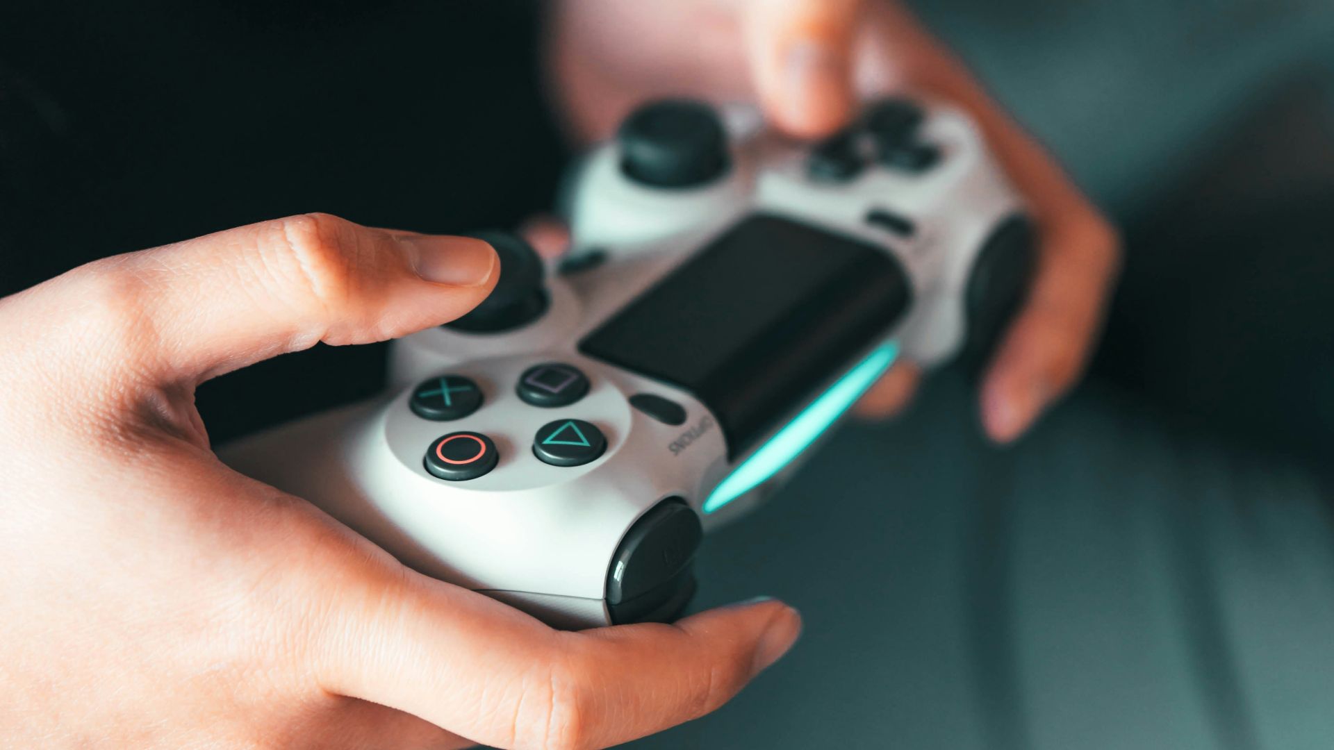 person holding gray game controller
