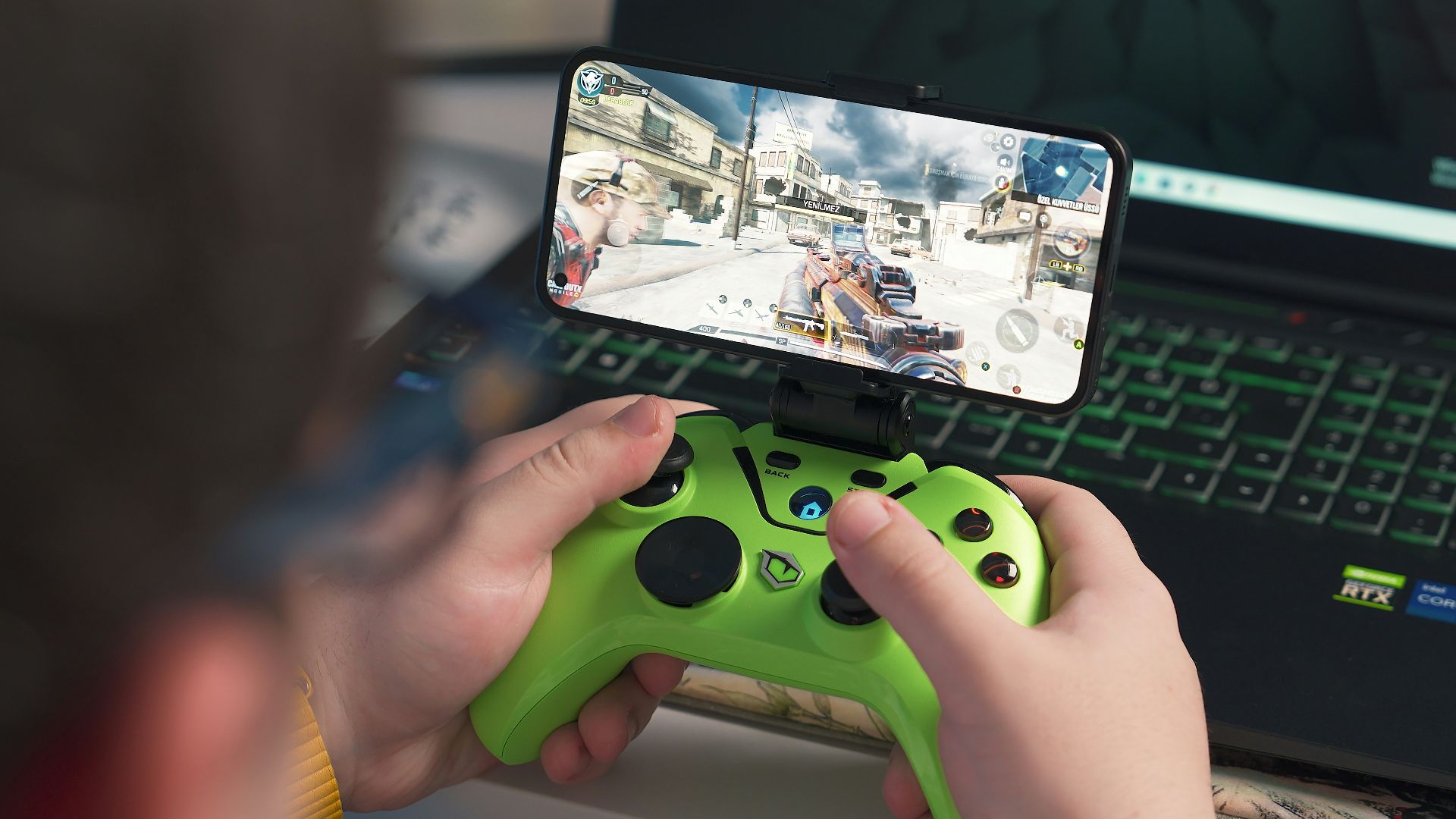 a person playing a video game on a laptop