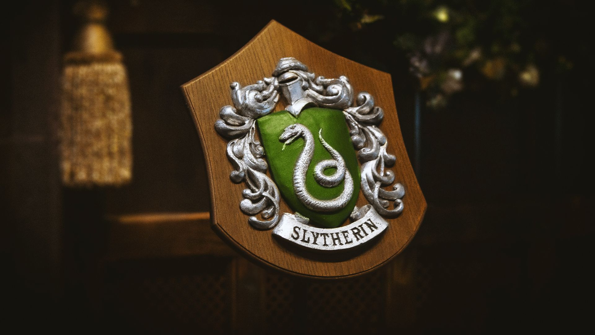 gold and green lion logo