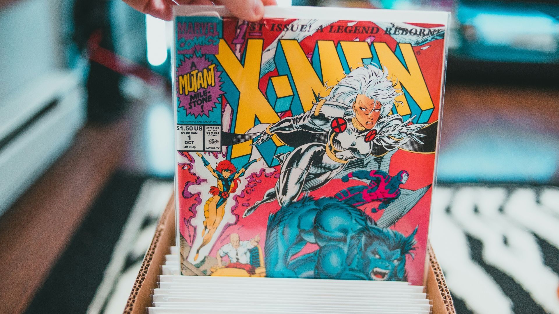 a person holding a comic book in their hand
