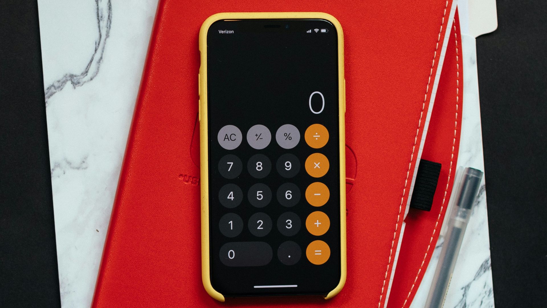 black Android smartphone on red flip case