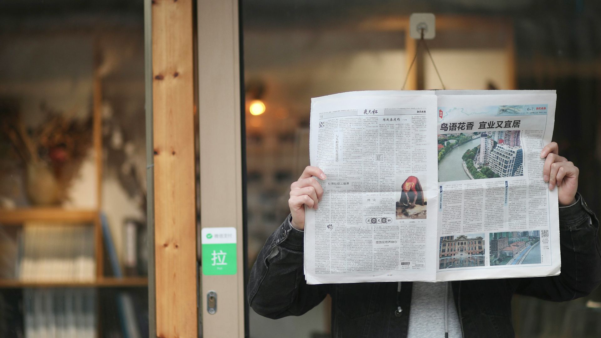 person holding white printer paper