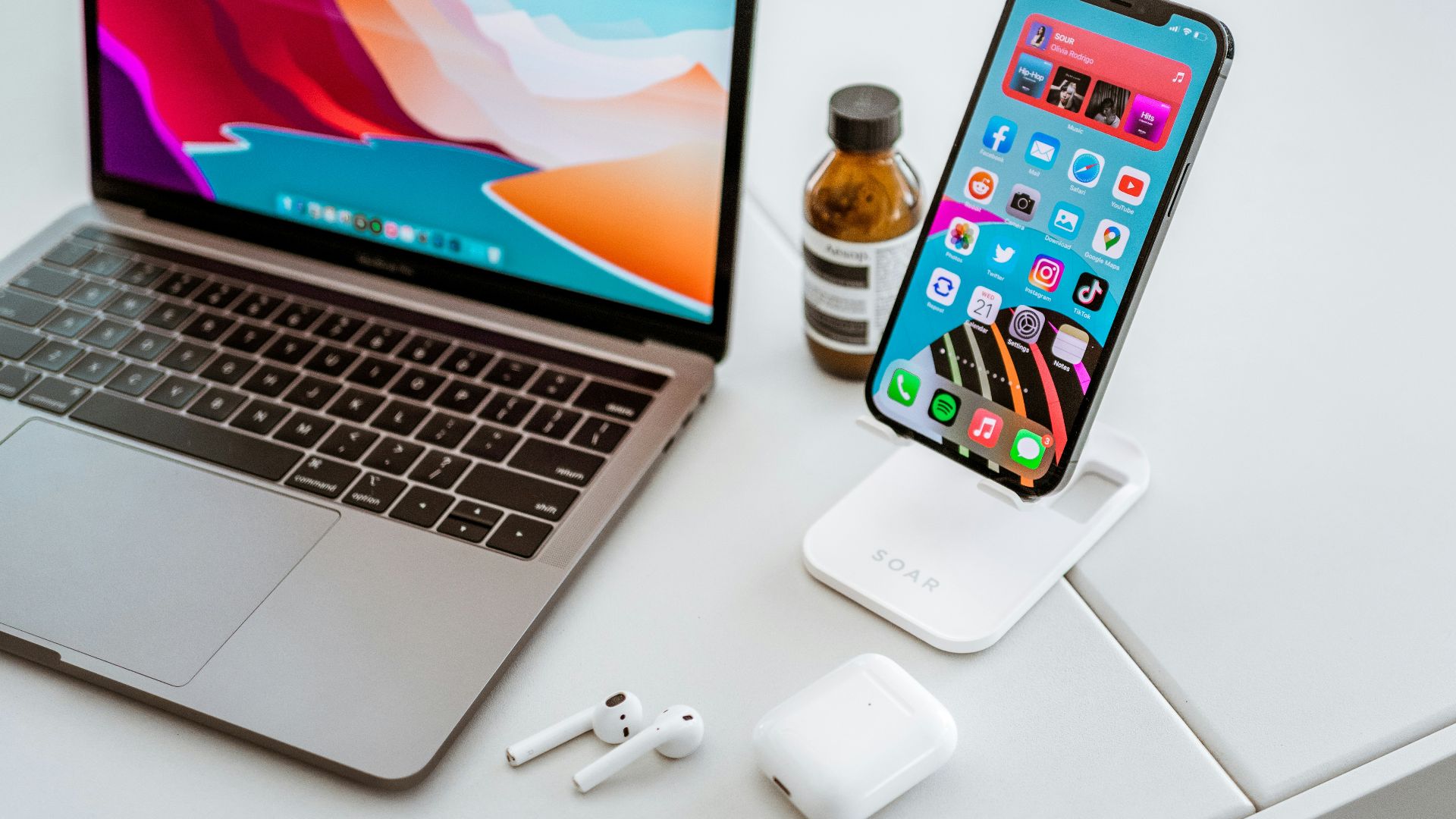 a laptop computer sitting on top of a white table