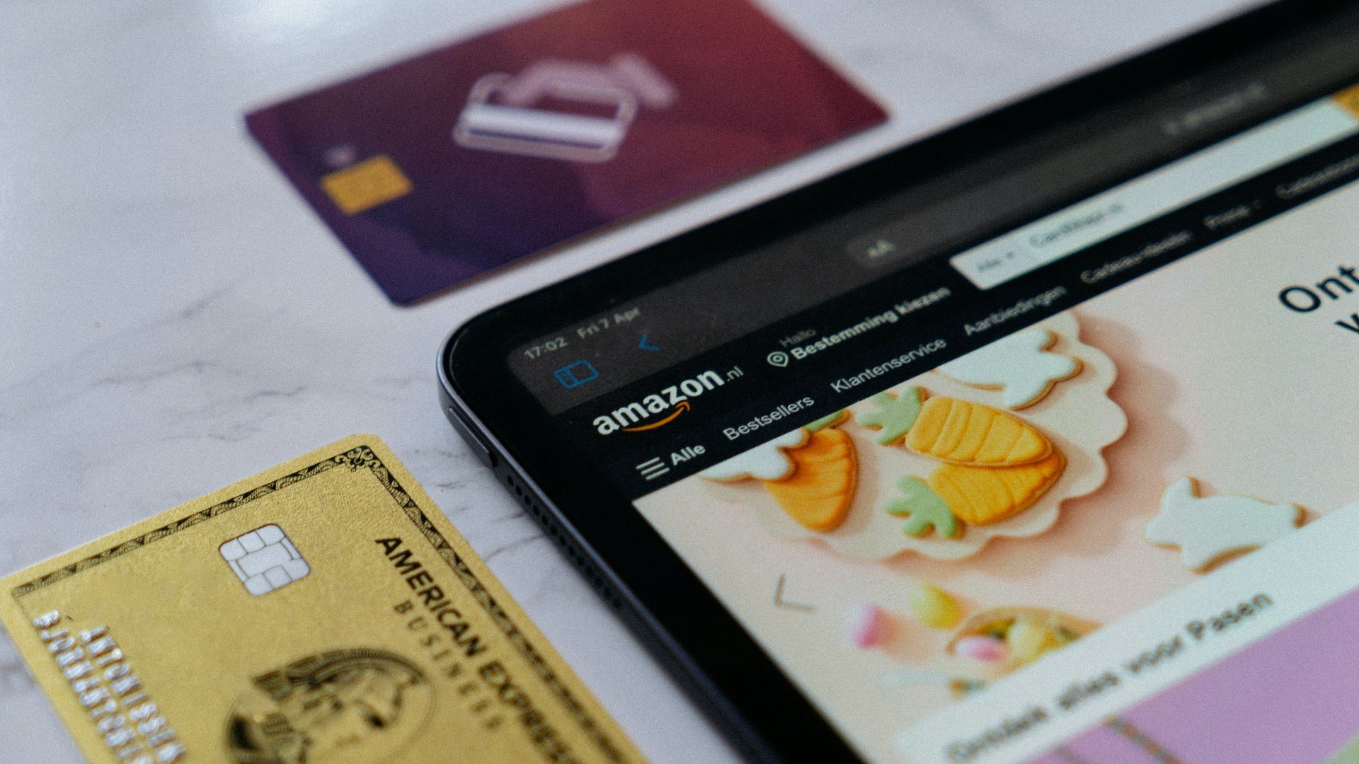 a smart phone sitting next to a credit card