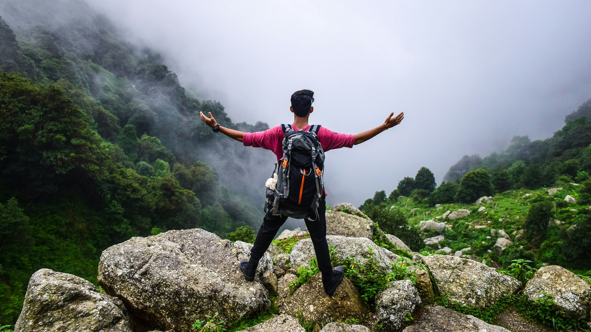 man standing on mountain