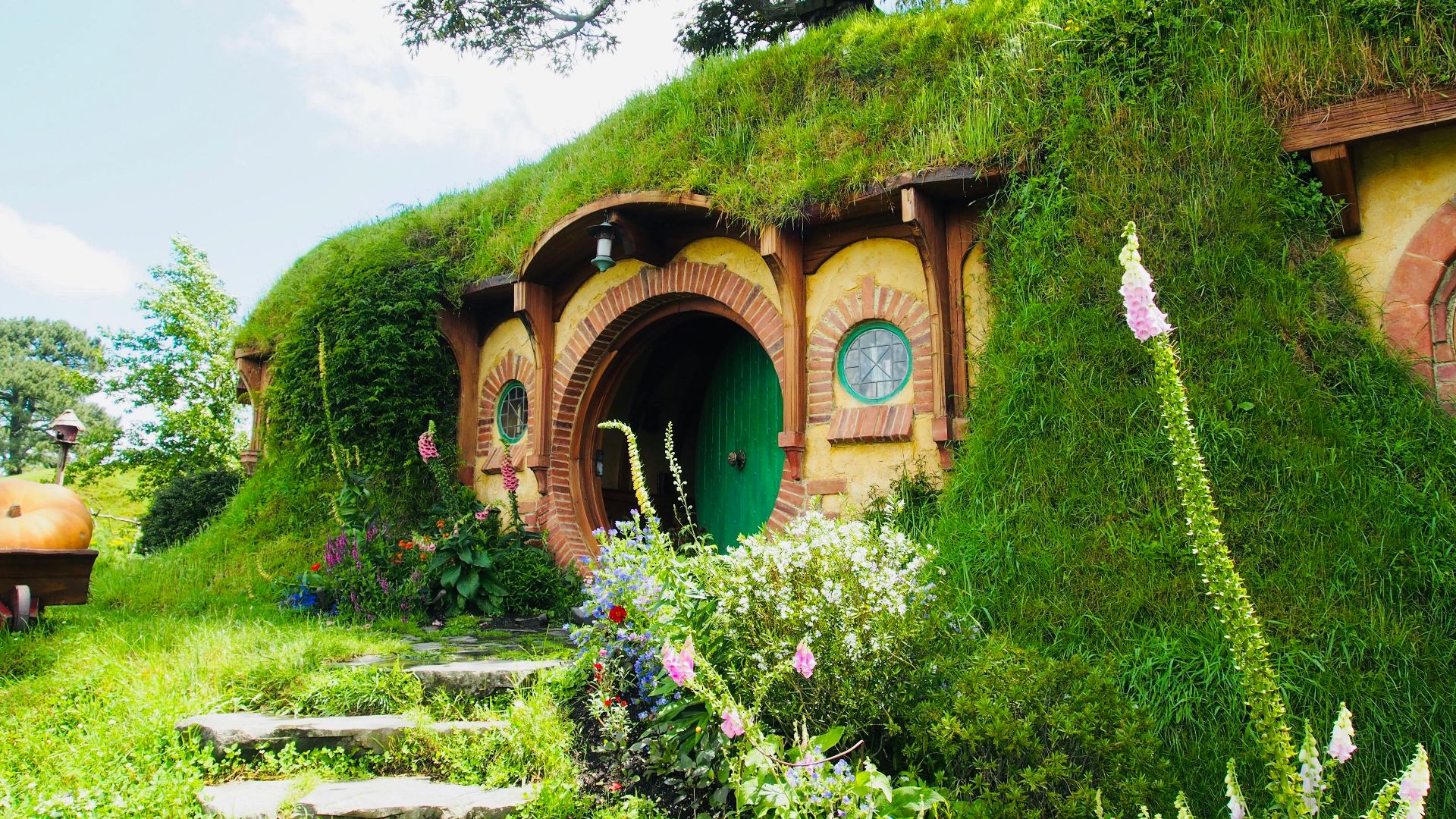 brown concrete building near green grass field during daytime