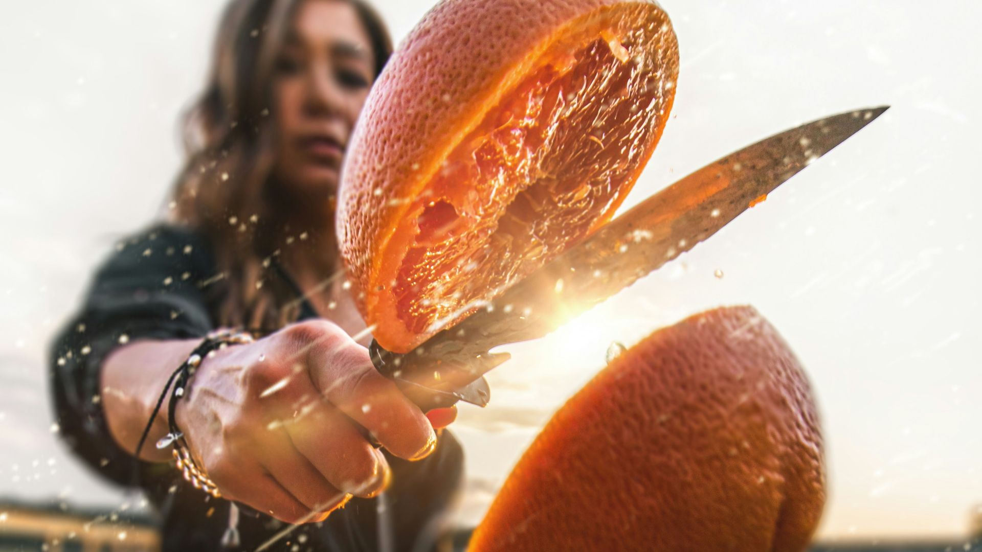 woman standing holding gray knife