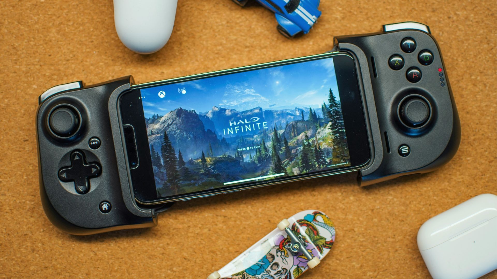 a game controller sitting next to a smart phone