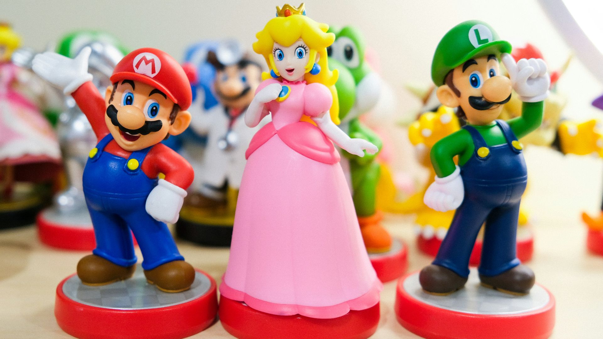 Mario, Luigi, and Princess Peach figurines