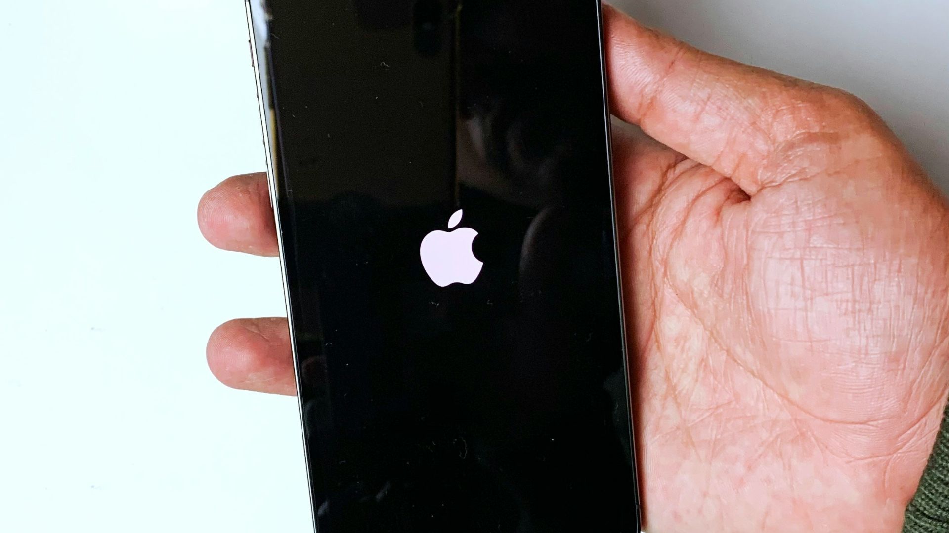 person holding black iphone 4