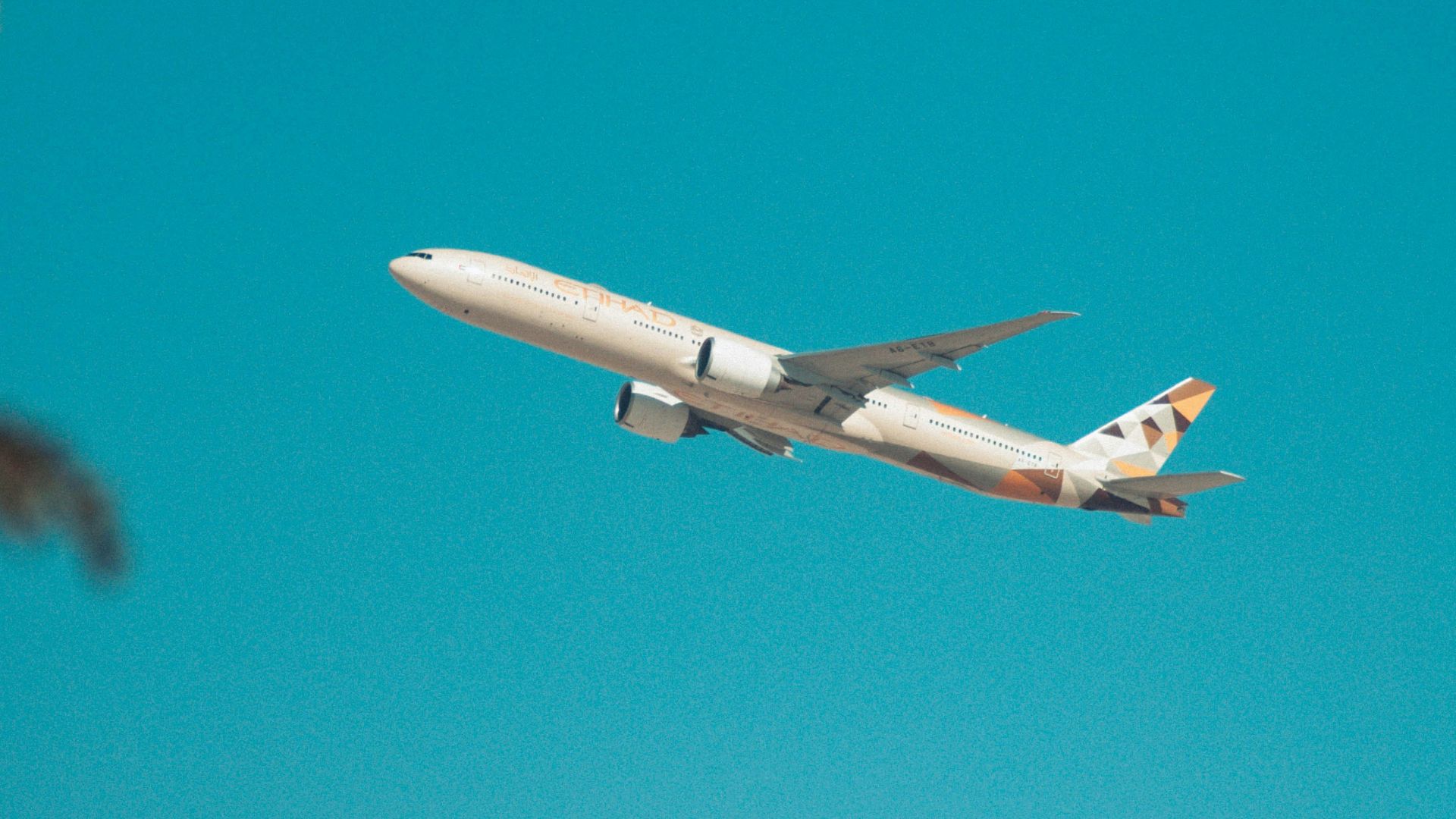 white airplane flying in the sky during daytime