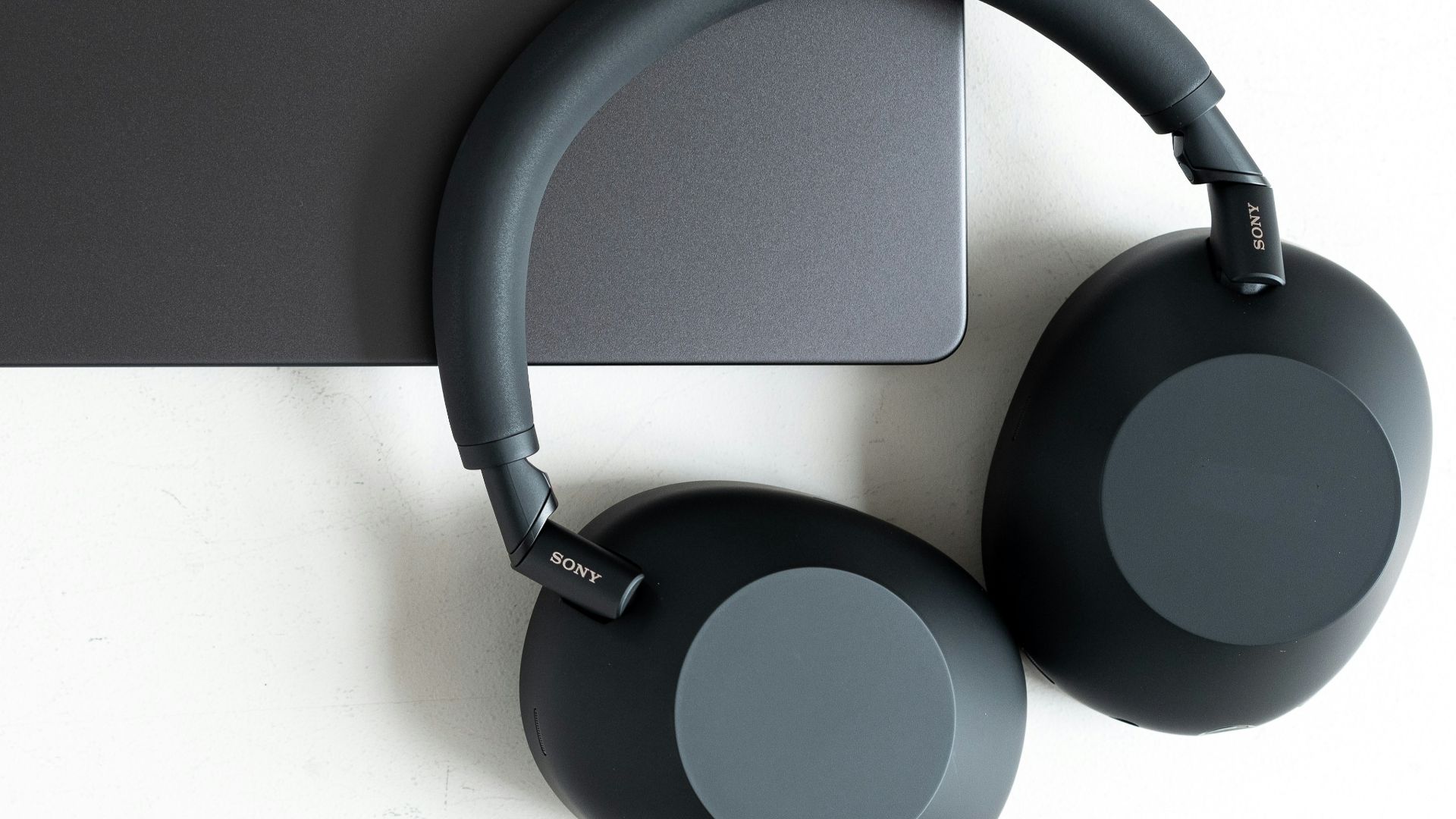 A laptop and headphones are pictured.