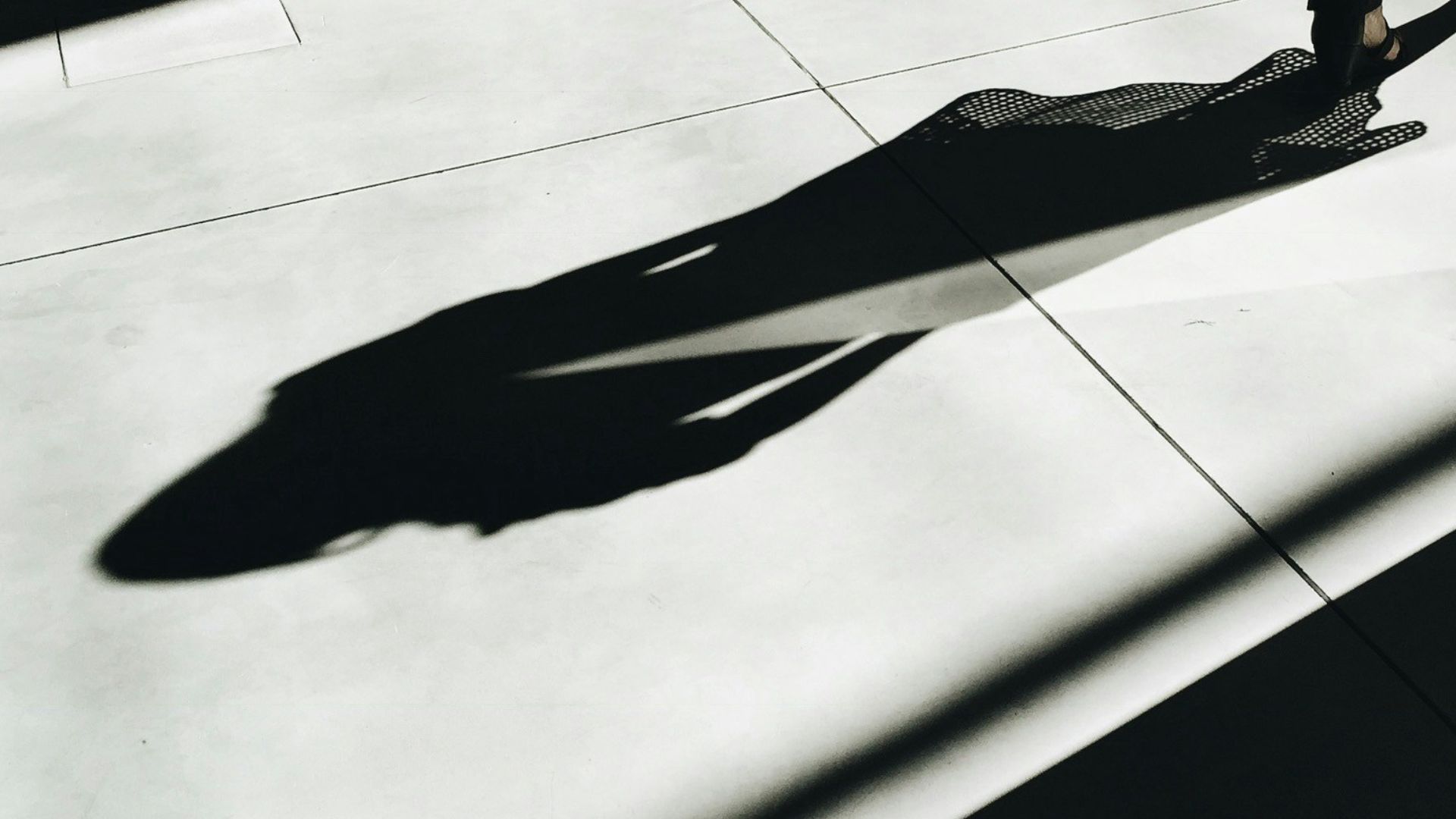 woman walking with shadow