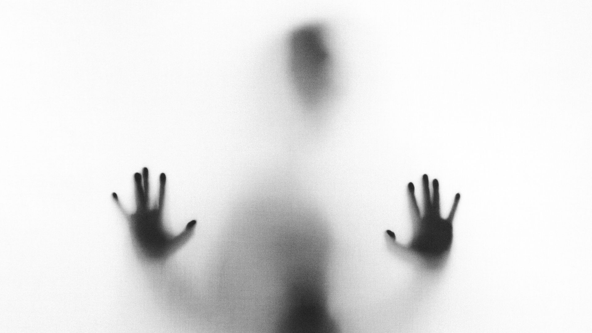 person behind fog glass