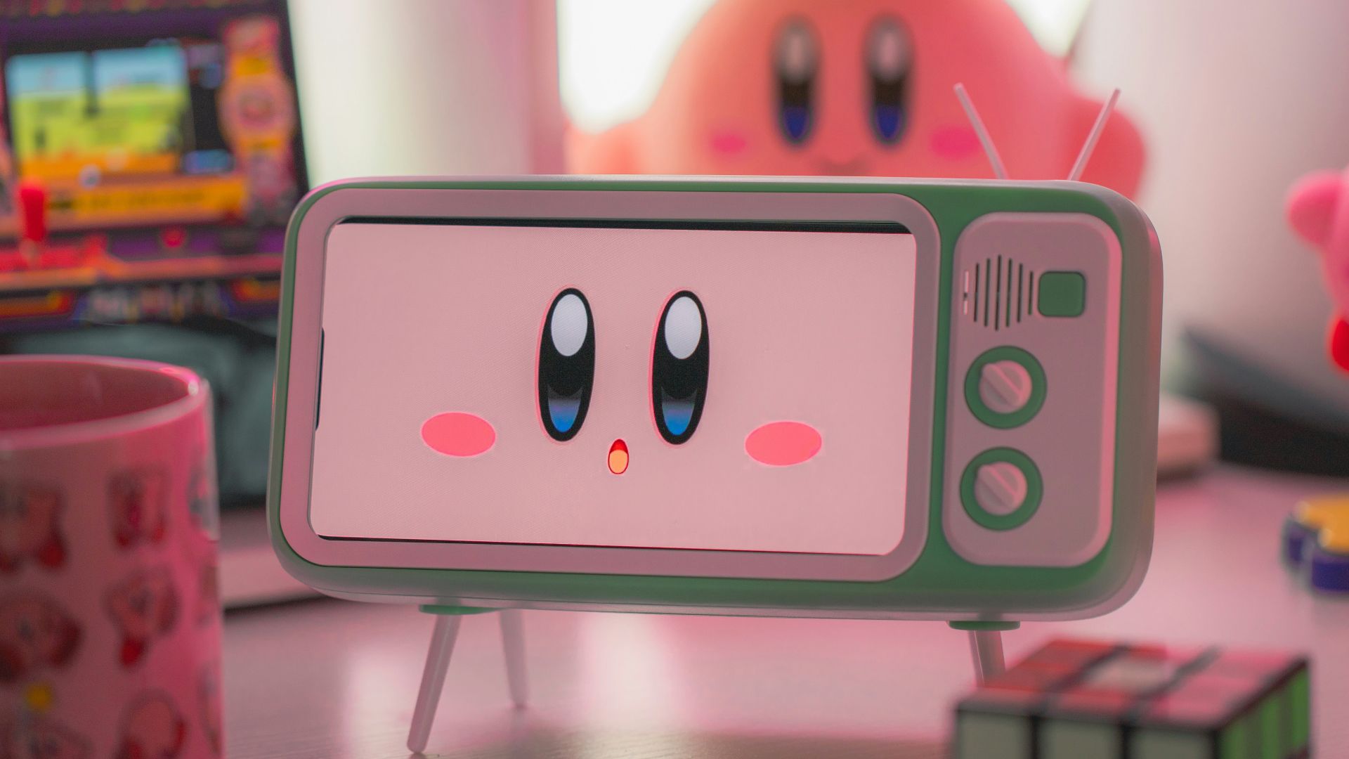 a pink and green toy is on a table