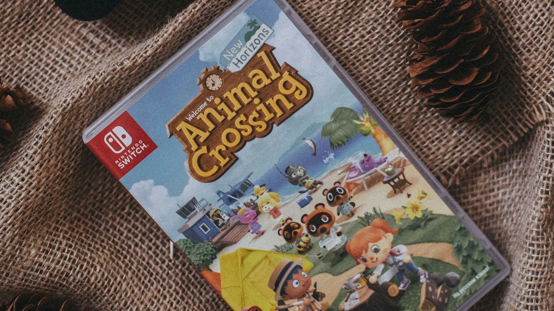 a nintendo wii game sitting on top of a blanket