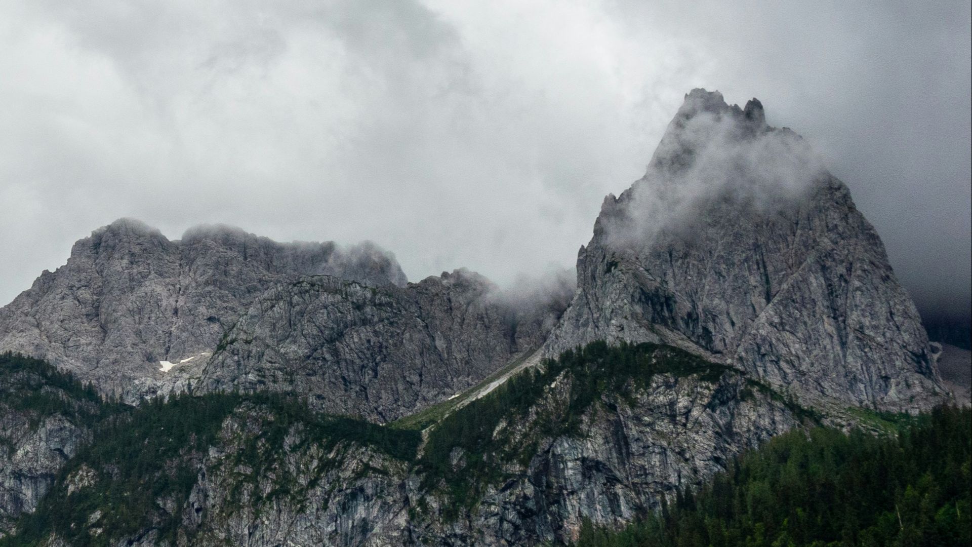 green and gray mountain under white clouds