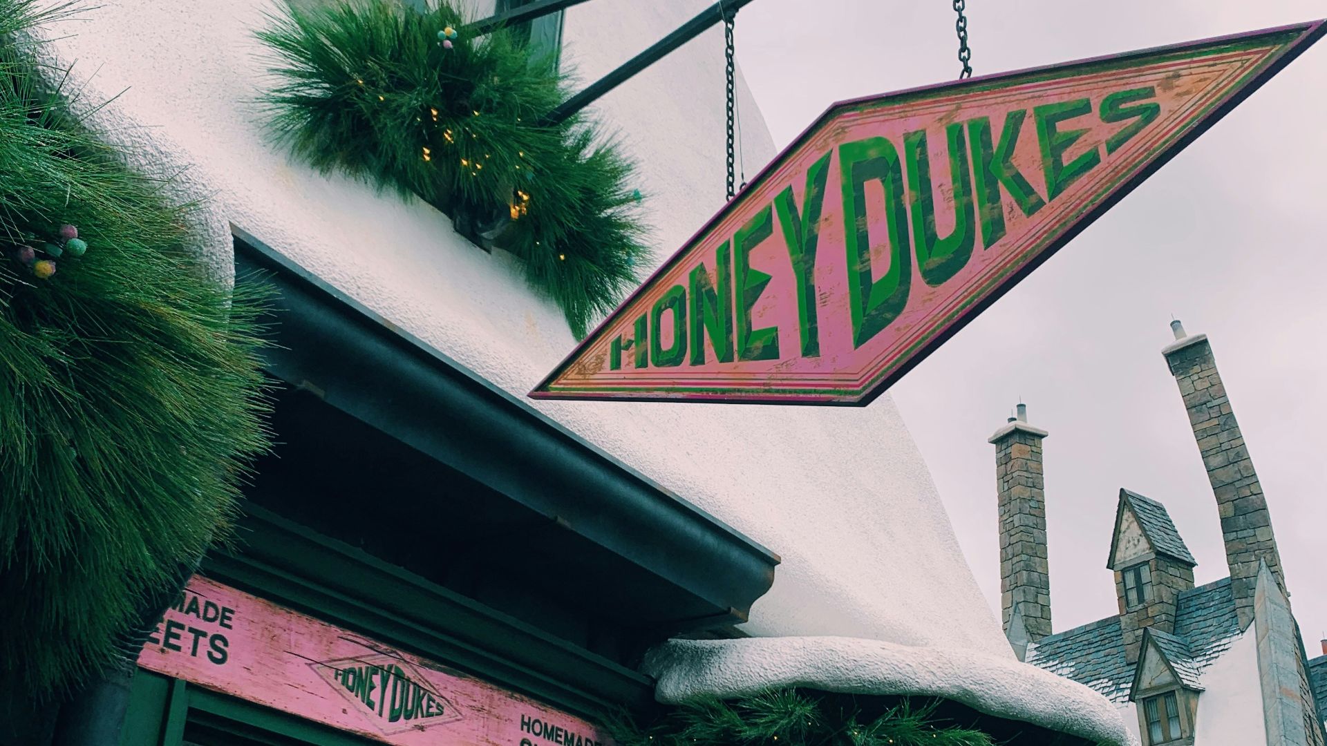 green tree near white concrete building