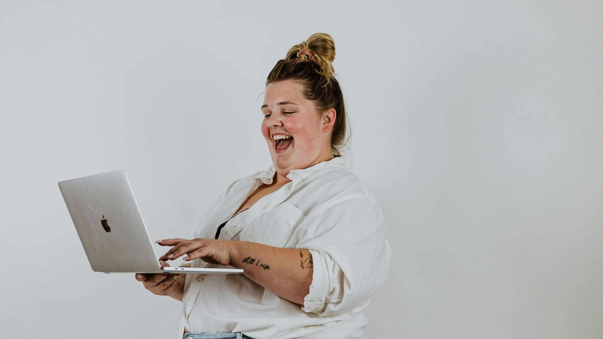 a man holding a laptop