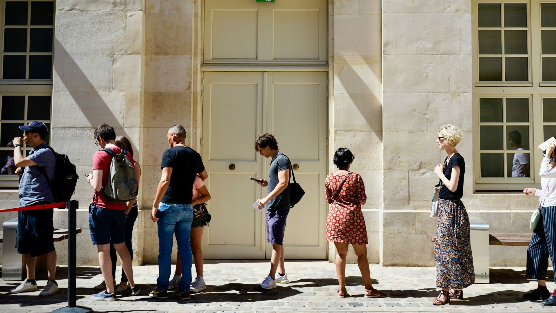 a group of people standing outside a building