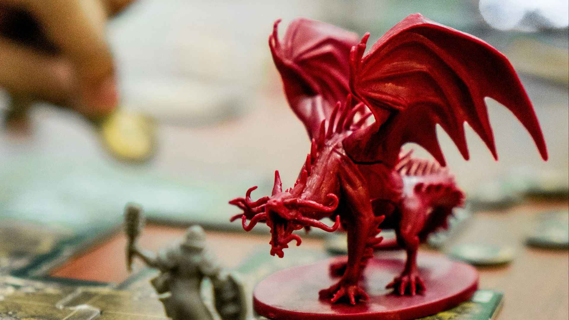 red dragon action figure on table