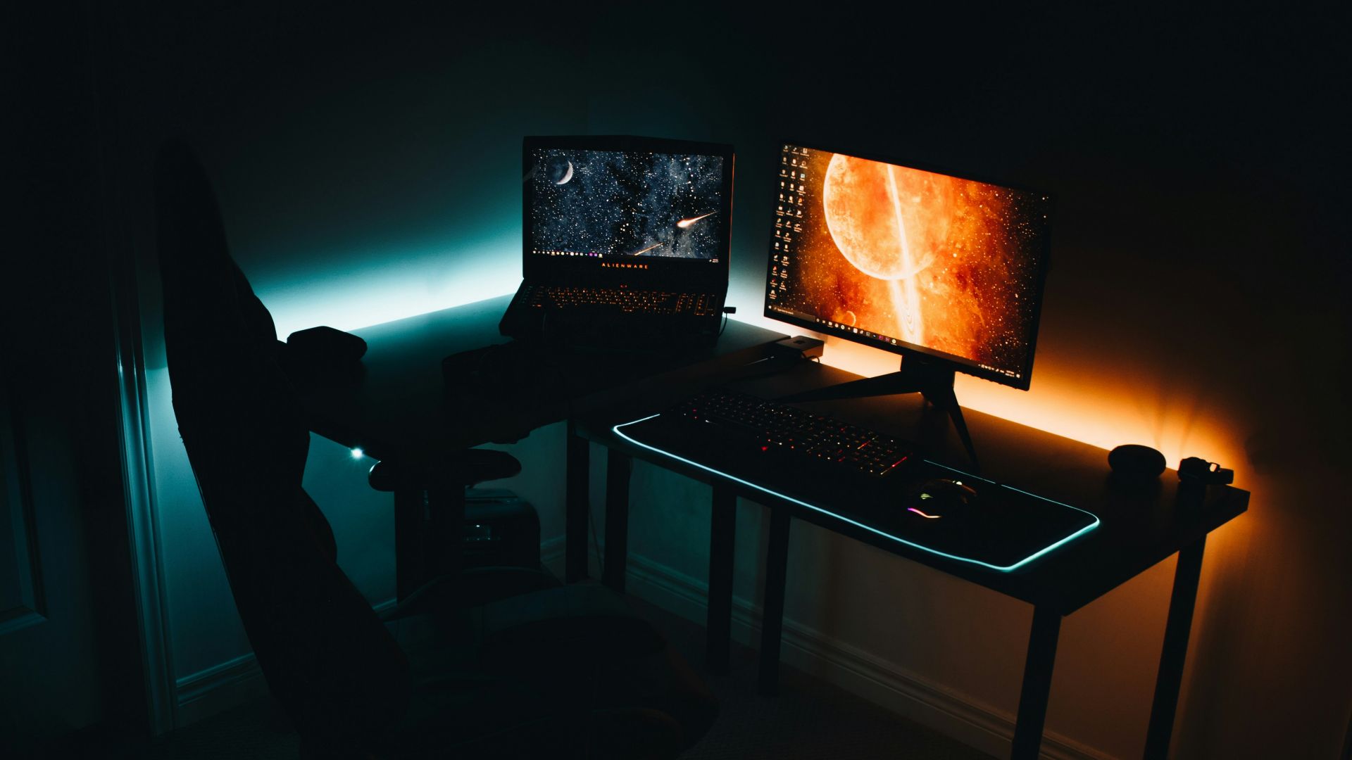 black laptop computer turned on near person standing
