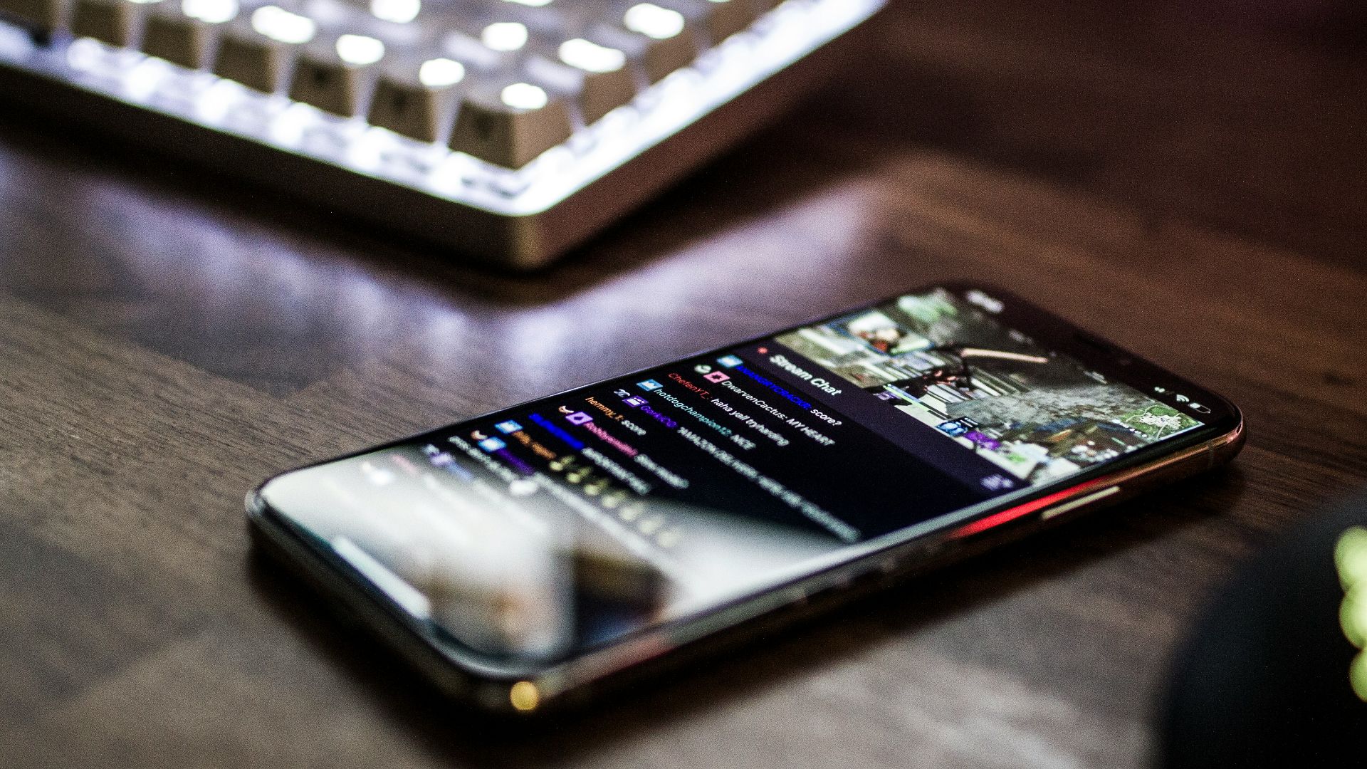 closeup photo of turned on smartphone near keyboard