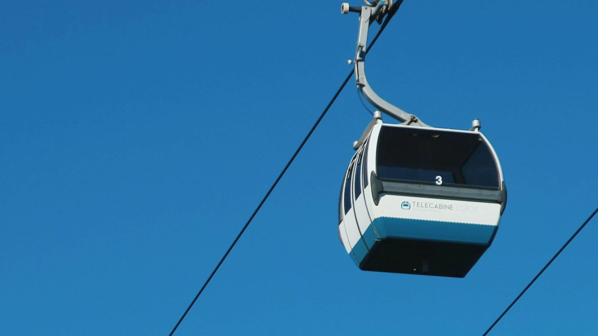 white cable car under blue sky during daytime