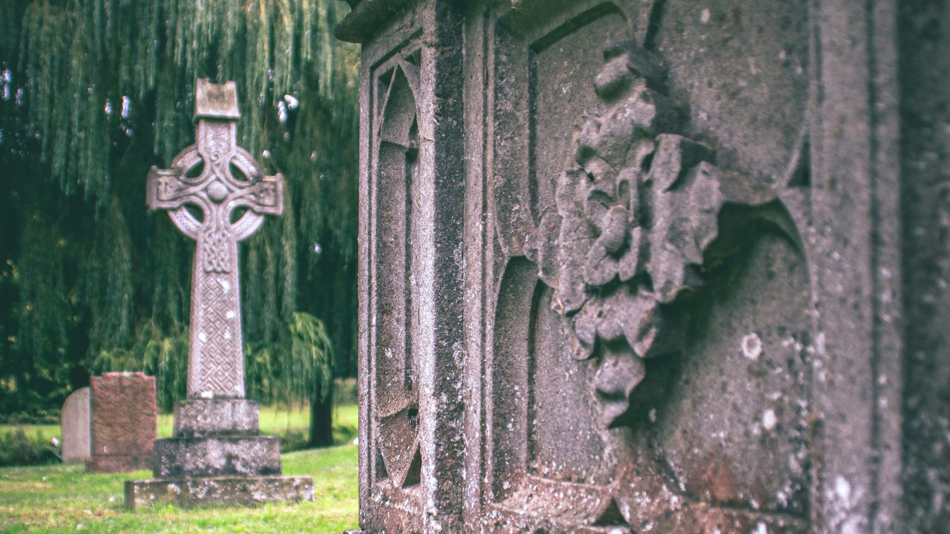 a stone building with a cross on top
