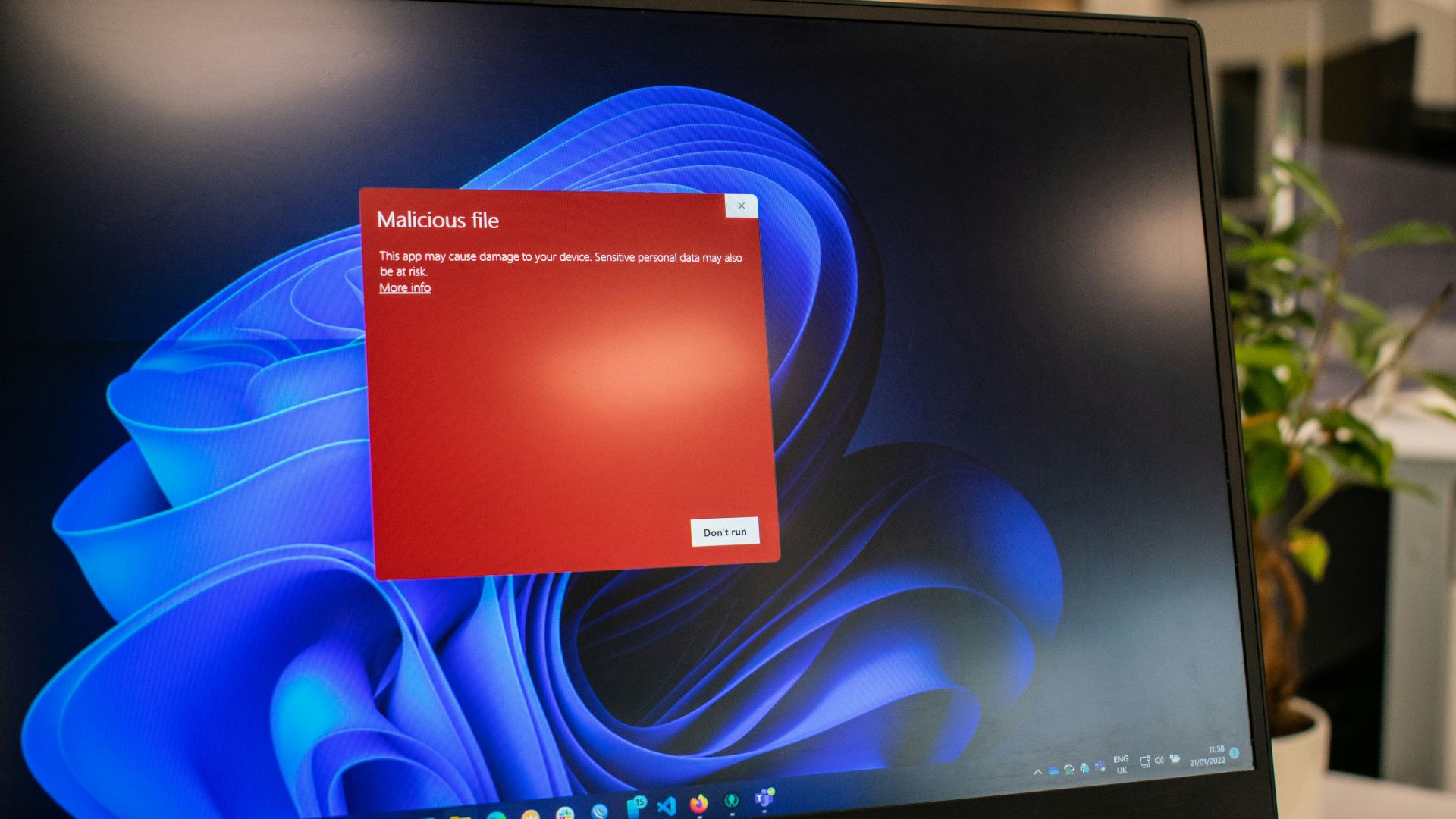 a dell laptop computer with a red screen