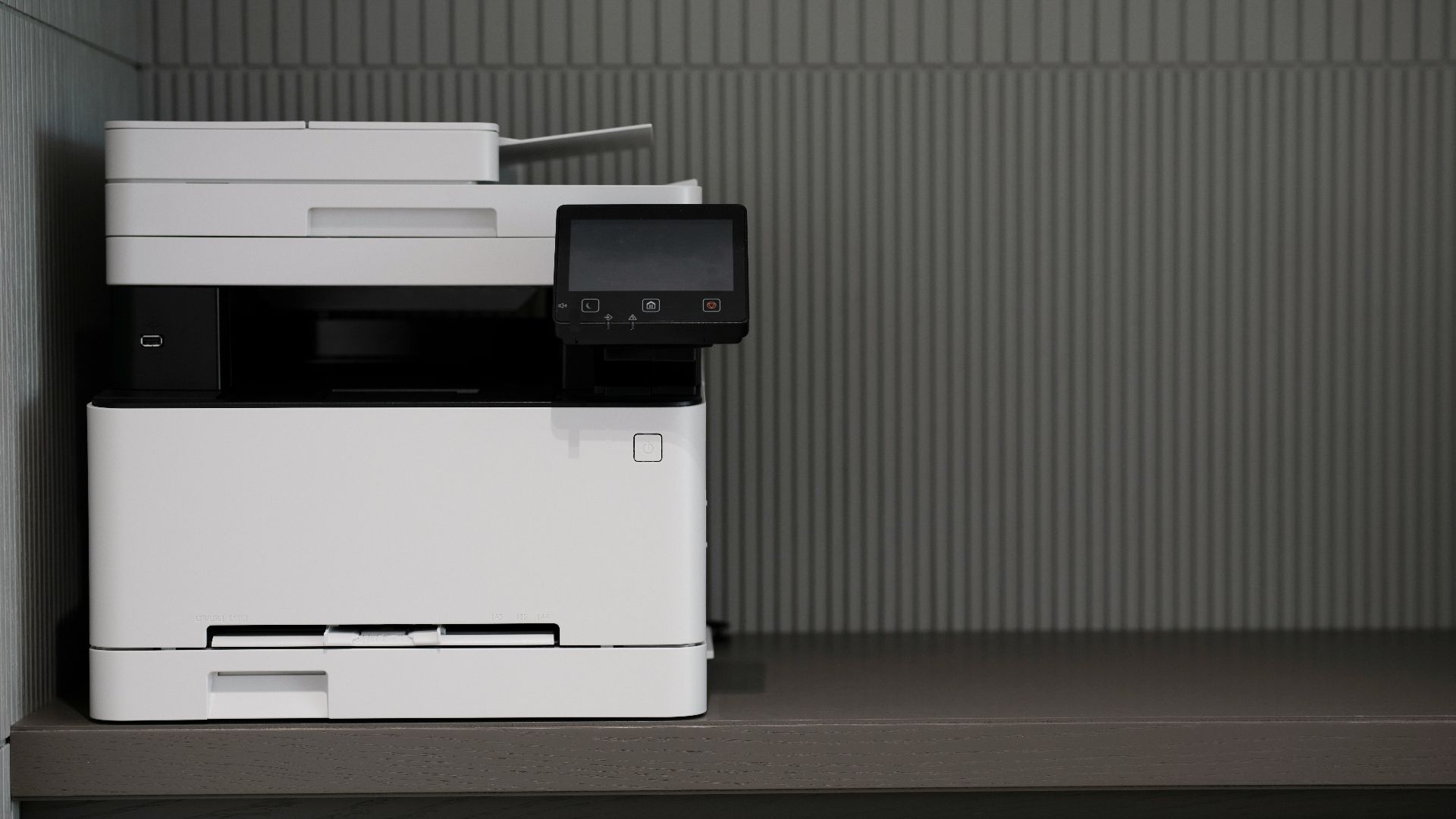 a white and black printer sitting on top of a counter