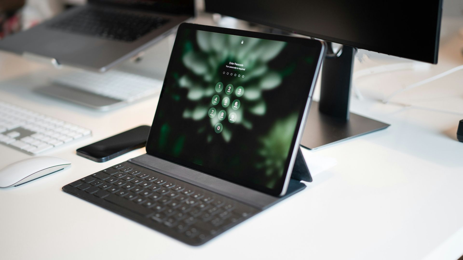 a laptop computer sitting on top of a white desk