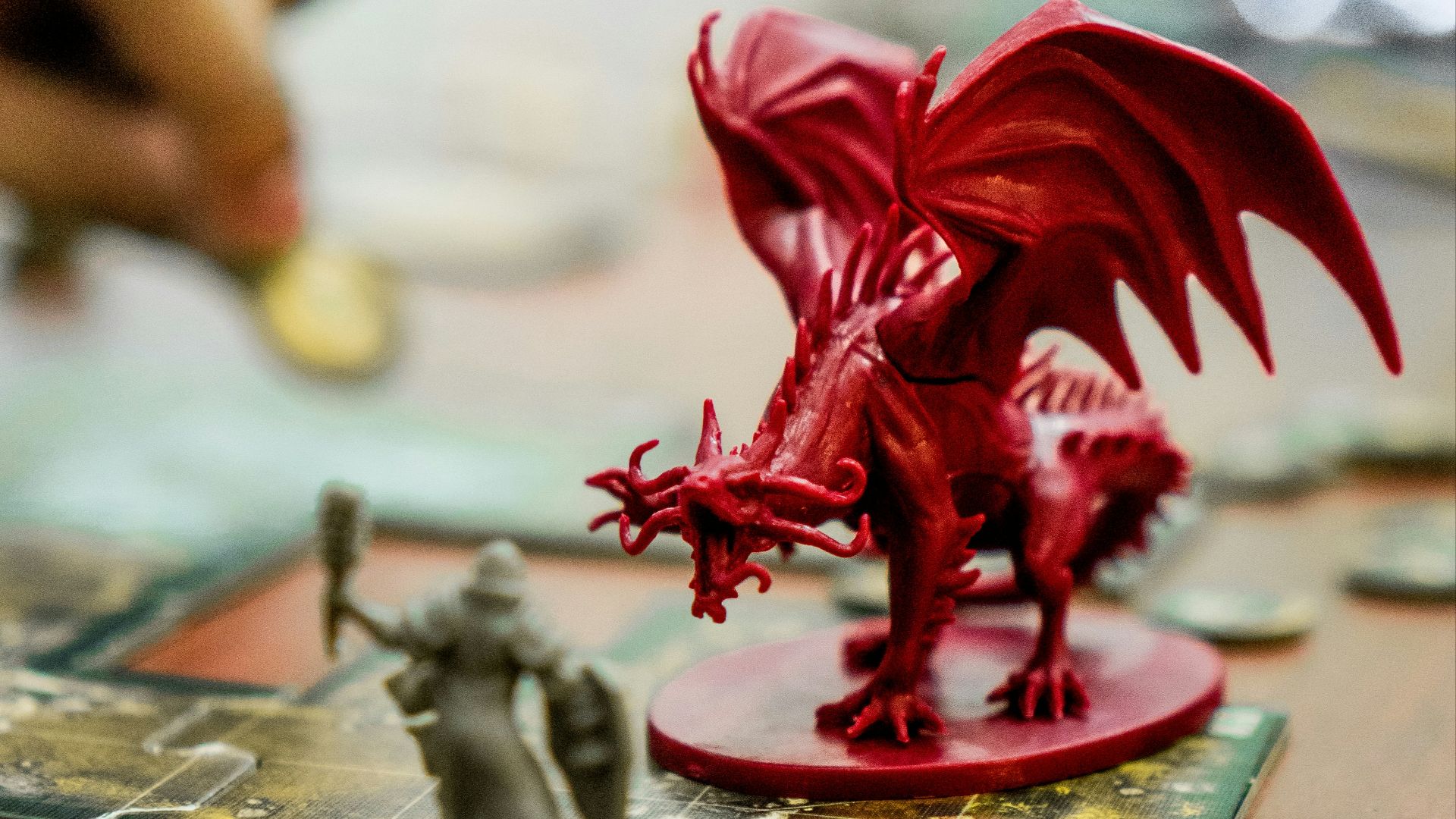red dragon action figure on table