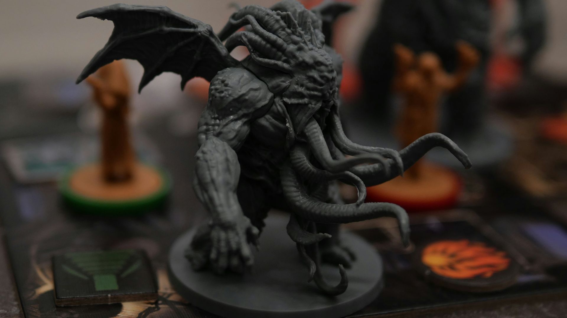 a close up of a dragon figurine on a board game