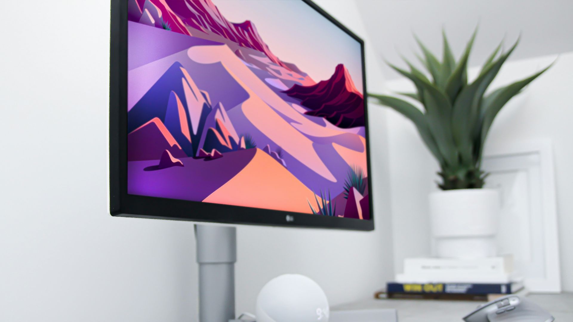 black flat screen tv turned on near white apple keyboard